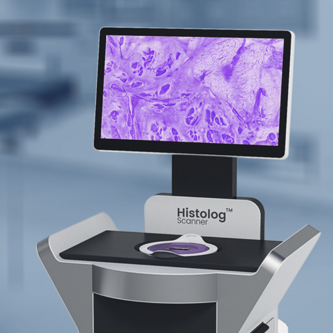 Digital histology scanner displaying a magnified tissue sample on its screen.